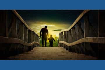 pai e filho caminhando de mãos dadas